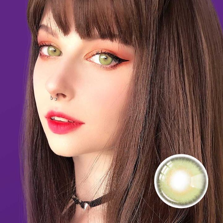 Close-up portrait of a model wearing Say Yes Dancing Green lenses, highlighting their vivid green tones and unique glowing effect.