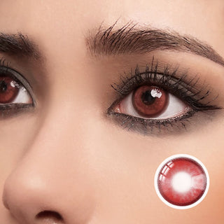 Close-up of a model wearing Red Hot Rebel contact lenses with dramatic design, enhancing eye appearance for bold and intense looks.