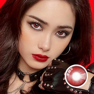 Model wearing Red Hot Rebel red contact lenses with bold makeup and edgy outfit, showcasing a fierce and dramatic cosplay-inspired look.