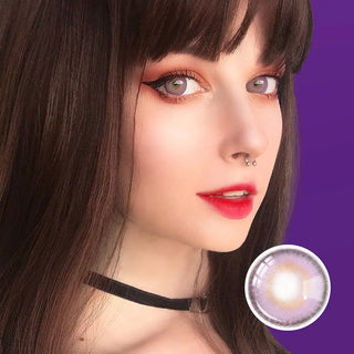 Close-up portrait of a model with Say Yes Nightout Violet lenses, enhanced by sleek bangs and sharp eyeliner for a bold, edgy appearance.