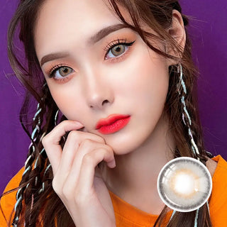 Portrait of a model with Say Yes Spotlight Gray lenses, complemented by braided hair and bold red lips for a striking look.